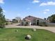 Two-story house with landscaped lawn at 7329 N 173Rd Ave, Waddell, AZ 85355