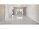 Living room with tile floors, ceiling fan, and neutral walls at 19826 N 129Th Dr, Sun City West, AZ 85375