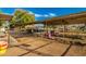 Covered stalls and seating area in a horse stable at 7642 N 177Th Ave, Waddell, AZ 85355