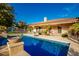 Refreshing blue pool with patio and landscaping at 7642 N 177Th Ave, Waddell, AZ 85355