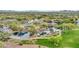 Aerial view of community park with lake, playground, and walking paths at 40708 N Apollo Way, Anthem, AZ 85086