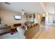 Open living room with built-in shelving and staircase access at 46024 W Amsterdam Rd, Maricopa, AZ 85139