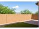 Landscaped backyard with artificial turf and gravel at 18788 E Blue Sky Dr, Rio Verde, AZ 85263