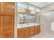 Bathroom with double vanity and walk-in shower at 22603 N Wagon Wheel Dr, Sun City West, AZ 85375