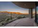 Sunset view from expansive stone patio at 8877 E Charolais Dr, Scottsdale, AZ 85262