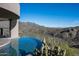 Stunning infinity pool with panoramic mountain views at 8877 E Charolais Dr, Scottsdale, AZ 85262