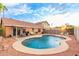 Spacious backyard with a refreshing pool, comfortable seating, and a grill at 1000 W Hudson Way, Gilbert, AZ 85233