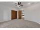 Bright bedroom featuring wood doors and plush carpeting at 1621 E Rolling Rock Dr, Phoenix, AZ 85086