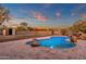 Freeform swimming pool with waterfall feature and mountain views at 1621 E Rolling Rock Dr, Phoenix, AZ 85086