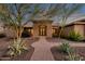 Stunning desert home with a welcoming front entrance and landscaped pathway at 1621 E Rolling Rock Dr, Phoenix, AZ 85086