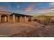 Brick pathway leads to a pergola-covered patio and yard at 1621 E Rolling Rock Dr, Phoenix, AZ 85086