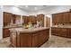 Gourmet kitchen with a large island and ample wood cabinetry at 1621 E Rolling Rock Dr, Phoenix, AZ 85086