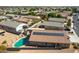 Aerial view of a house featuring solar panels and a refreshing blue pool at 786 W Jahns Dr, Casa Grande, AZ 85122