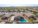 Aerial view of a house with solar panels, a pool, and a detached shed in a neighborhood at 786 W Jahns Dr, Casa Grande, AZ 85122
