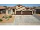 House exterior showcasing a two-car garage and desert landscaping at 786 W Jahns Dr, Casa Grande, AZ 85122