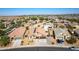 Aerial view of a house with a pool and two-car garage, situated in a neighborhood at 786 W Jahns Dr, Casa Grande, AZ 85122
