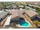 Aerial view of house, pool, and surrounding neighborhood at 786 W Jahns Dr, Casa Grande, AZ 85122