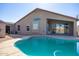 Inviting kidney-shaped pool in a backyard setting with patio access at 786 W Jahns Dr, Casa Grande, AZ 85122