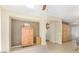 Living room with wood cabinet and access to kitchen at 7117 W Globe Ave, Phoenix, AZ 85043