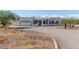 Single story home with a large gravel driveway and desert landscape at 36382 N 35Th St, Cave Creek, AZ 85331