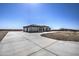 Single story home with a large driveway and desert landscaping at 29923 W Melvin St, Buckeye, AZ 85396