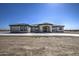 Single story home with a large driveway and desert landscaping at 29923 W Melvin St, Buckeye, AZ 85396