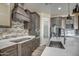 Stylish kitchen boasts dark cabinetry, a large island, and upgraded appliances at 29923 W Melvin St, Buckeye, AZ 85396