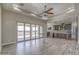 Open living room with hardwood floors and access to the backyard at 29923 W Melvin St, Buckeye, AZ 85396