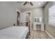 Well lit bedroom with vanity and ceiling fan at 29923 W Melvin St, Buckeye, AZ 85396
