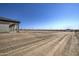 Large undeveloped lot with dirt and tire tracks at 29923 W Melvin St, Buckeye, AZ 85396