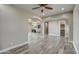 Open living area with wood-look floors, leading to kitchen and backyard at 29923 W Melvin St, Buckeye, AZ 85396