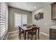 Cozy breakfast nook features a wooden table and chairs, perfect for morning meals at 29923 W Melvin St, Buckeye, AZ 85396