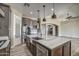 Open kitchen features a large island, stainless steel appliances, and recessed lighting at 29923 W Melvin St, Buckeye, AZ 85396