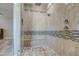 Large walk-in shower with tiled walls and built-in seat at 29923 W Melvin St, Buckeye, AZ 85396