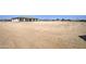Large undeveloped lot with dirt and tire tracks at 29923 W Melvin St, Buckeye, AZ 85396