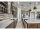 Spacious kitchen with island, stainless steel appliances, and dark wood cabinets at 29923 W Melvin St, Buckeye, AZ 85396