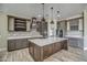 Modern kitchen with large island, stainless steel appliances, and ample cabinetry at 29923 W Melvin St, Buckeye, AZ 85396