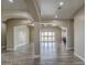Open concept living room with wood-look tile floors and access to backyard at 29923 W Melvin St, Buckeye, AZ 85396