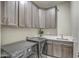 Laundry room with washer, dryer, cabinets and sink at 29923 W Melvin St, Buckeye, AZ 85396