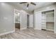 Bright bedroom with wood-look floors and walk-in closet at 29923 W Melvin St, Buckeye, AZ 85396