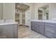 Modern bathroom with double vanity and large walk-in closet at 29923 W Melvin St, Buckeye, AZ 85396