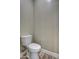 Simple bathroom with toilet and wood-look tile floor at 29923 W Melvin St, Buckeye, AZ 85396