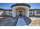 Elegant home entryway with arched entry and decorative doors at 29923 W Melvin St, Buckeye, AZ 85396