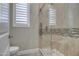 Modern bathroom with a large glass shower and neutral tile at 29923 W Melvin St, Buckeye, AZ 85396