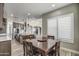 Charming breakfast nook adjacent to the kitchen with a view of the backyard at 29923 W Melvin St, Buckeye, AZ 85396