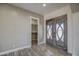 Elegant entryway with double doors and coat closet at 29923 W Melvin St, Buckeye, AZ 85396