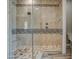 Large walk-in shower with tiled walls and built-in seat at 29923 W Melvin St, Buckeye, AZ 85396