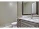 Simple bathroom with single sink vanity and toilet at 29923 W Melvin St, Buckeye, AZ 85396