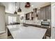 Modern kitchen with large island, stainless steel appliances, and ample cabinetry at 29923 W Melvin St, Buckeye, AZ 85396