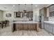 Modern kitchen with large island, stainless steel appliances, and ample cabinetry at 29923 W Melvin St, Buckeye, AZ 85396